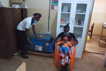 Health care worker with patients in medical center