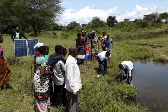 Several people near a pond