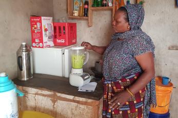 Woman watching a blender