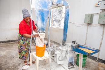 A person working with cooking equipment