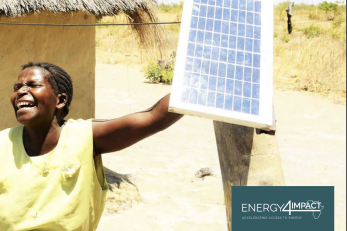 woman holding a solar panel
