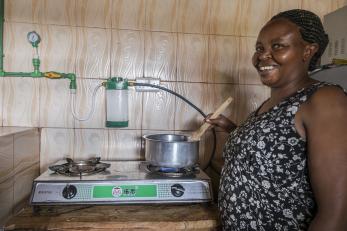 woman stirring food in a pot