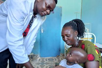 doctor with child and woman