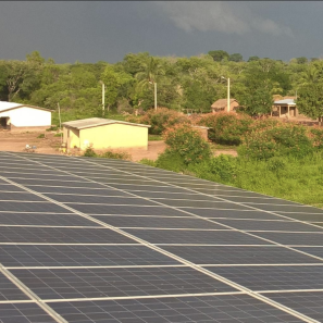 Overhead view of solar panels and village