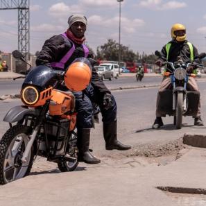 Two adults on motorcycles