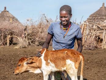 A person with their farm animal.
