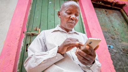 Kenyan man on his smartphone