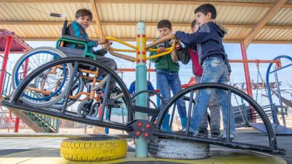 Yousef, left, plays at an inclusive playground at Zaatari refugee camp in Jordan. Prosper Global’s inclusive education program supports schools at the camp, which houses the largest population of Syrian refugees.