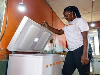 woman looking in freezer