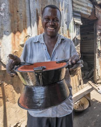 Man holding cooking pot