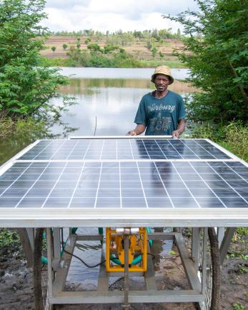 man standing with solar panel