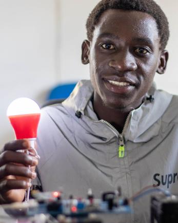 man holding lightbulb