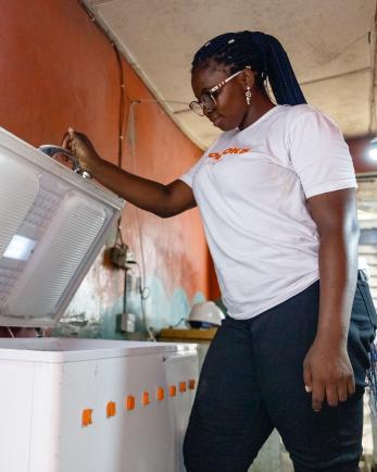 woman looking in freezer