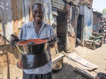 Man holding cooking pot