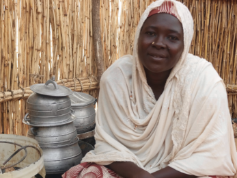 Woman sitting near pots