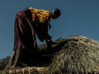Woman on hatched roof