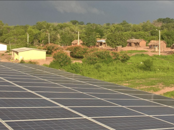 Overhead view of solar panels and village