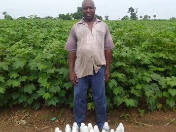 Man standing next to water bottles