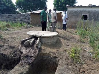 People standing near a well