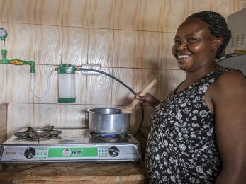 Woman stirring food in a pot