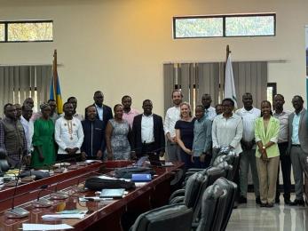 Group of people standing in conference room