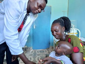 Doctor with child and woman