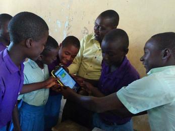 Children looking at a mobile device