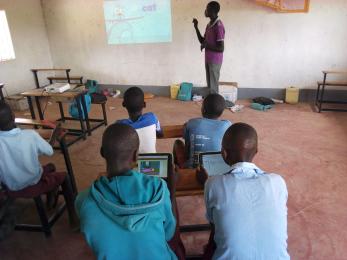 Man talking to small classroom