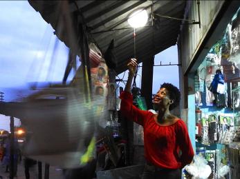 Woman turning on light