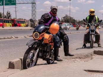 Two adults on motorcycles